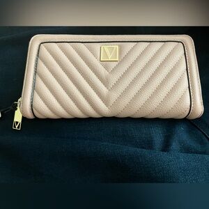 Victorias secret wallet.  Pink leather with gold accents.  New with tags